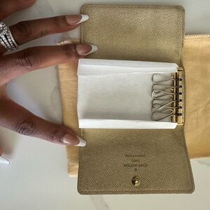 Louis Vuitton Tan Key Holder in the classic damier azur print .